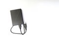 External compact SSD-drive with USB cable for writing, reading and storing data. on white background, top view Royalty Free Stock Photo