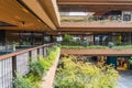 External Courtyard of a Retail Complex with Lush Greenery on Landscape Terraces