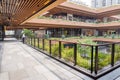 External Courtyard of a Retail Complex with Lush Greenery on Landscape Terraces