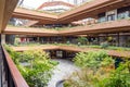 External Courtyard of a Retail Complex with Lush Greenery on Landscape Terraces