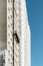 External empty front elevator for facade repair work on the background of the facade under construction without workers, frozen Royalty Free Stock Photo