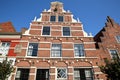 The external facade of historic houses with carvings, located on Cattenhage street inside the fortified town of Naarden