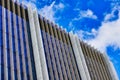 External Detail of Modern Office Building, With Scattered White Clouds Royalty Free Stock Photo