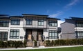 External facade of a row of colorful modern urban townhouses.brand new houses just after construction on real estate market Royalty Free Stock Photo