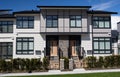 External facade of a row of colorful modern urban townhouses.brand new houses just after construction on real estate market Royalty Free Stock Photo