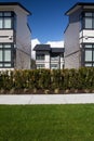 External facade of a row of colorful modern urban townhouses.brand new houses just after construction on real estate market Royalty Free Stock Photo