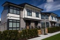 External facade of a row of colorful modern urban townhouses.brand new houses just after construction on real estate market Royalty Free Stock Photo