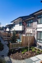 External facade of a row of colorful modern urban townhouses. brand new houses just after construction on real estate market Royalty Free Stock Photo