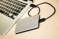 External hard drive connected to laptop computer Royalty Free Stock Photo