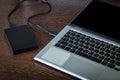 An external hard drive connected to the laptop Royalty Free Stock Photo