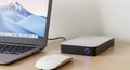 External Hard Drive Connected to Laptop with Mouse on Desk Royalty Free Stock Photo