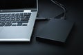 An external hard drive connected to the laptop with a usb cable Royalty Free Stock Photo