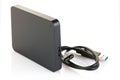 External hard drive disc with usb 3.0 cable, black. Best way of data storage on portable hdd. Close-up side left view isolated on Royalty Free Stock Photo