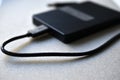 External hard drive with usb cable on a gray background Royalty Free Stock Photo
