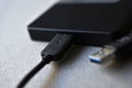 External hard drive with usb cable on a gray background Royalty Free Stock Photo