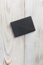 External hard drive for writing, reading and storing data on wood table Royalty Free Stock Photo