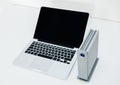 External HDD disk drive next to laptop - focus on HDD Royalty Free Stock Photo