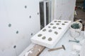External house wall insulation with polystyrene rigid foam insulation. Installing foam insulation boards to the house wall with Royalty Free Stock Photo