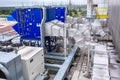 External infrastructure of the microclimate support system at a large industrial site. Air pipelines inlet and exhaust. Fans and Royalty Free Stock Photo