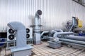External infrastructure of the microclimate support system at a large industrial site. Air pipelines inlet and exhaust. Fans and Royalty Free Stock Photo