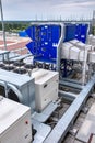 External infrastructure of the microclimate support system at a large industrial site. Air pipelines inlet and exhaust. Fans and Royalty Free Stock Photo