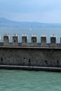 External wall of Sirmione Castle with Garda lake landscape Royalty Free Stock Photo