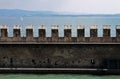 External wall of Sirmione Castle with Garda lake landscape Royalty Free Stock Photo