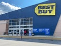 The exterior storefront of a Best Buy electronics retail store chain located in Orlando, Florida
