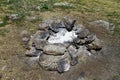 Extinct camp fire place surrounded with rocks or stones, photo of nature Royalty Free Stock Photo