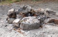 an extinct fire pit surrounded by stones