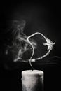 Extinct white candle with smoke on a black background Royalty Free Stock Photo