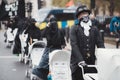 Extinction Rebellion activists marching slowly towards Downing Street with White Baby Prams