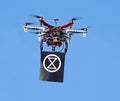 Extinction rebellion drone protests protest globe head man person protester sign image icon symbol logo slogan earth world