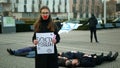 OLOMOUC, CZECH REPUBLIC, JANUARY 10, 2019: Extinction rebellion activist Anna Martinkova banner symbol circle hourglass