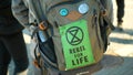 OLOMOUC, CZECH REPUBLIC, FEBRUARY 10, 2019: Extinction rebellion people activists backpack applique rebel for life