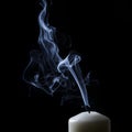 Extinguished candle with blue smoke Royalty Free Stock Photo