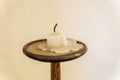 Extinguished candle in candlestick Royalty Free Stock Photo