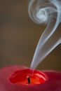Extinguished candle with smoke Royalty Free Stock Photo