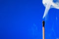 Extinguished Match On Blue Royalty Free Stock Photo