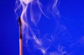 Extinguished Match On Blue Royalty Free Stock Photo
