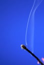 Extinguished Match On Blue Royalty Free Stock Photo