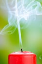 Extinguished red candle with smoke Royalty Free Stock Photo