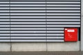 Extinguishing water feed on modern corrugated iron facade Royalty Free Stock Photo