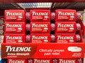 Extra Strength Tylenol 24 caplet boxes on the shelf in a drug store.