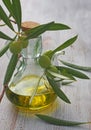 Extra-virgin olive oil bottle and green olivas Royalty Free Stock Photo