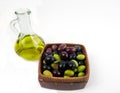 Extra virgin olive oil with fresh olives.