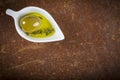 Extra virgin olive oil and green olives Royalty Free Stock Photo