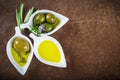 Extra virgin olive oil and green olives Royalty Free Stock Photo