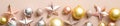 Extra wide Christmas border with golden and silver Xmas balls and pink stars on ivory background. Flat lay, top view, overhead. Royalty Free Stock Photo