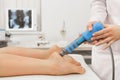 Extracorporeal Shockwave Therapy ESWT.Effective non-surgical treatment.Physical therapy for plantarfascitis with shock Royalty Free Stock Photo